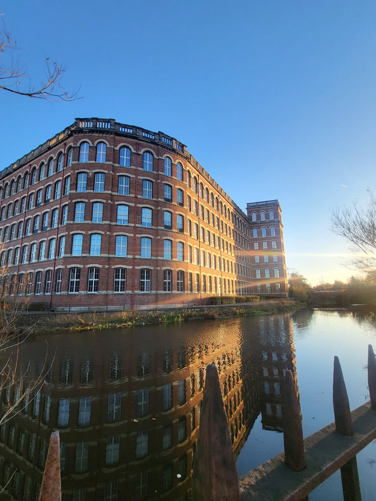 Paisley’s historic Anchor Mill reflected in the White Cart Water